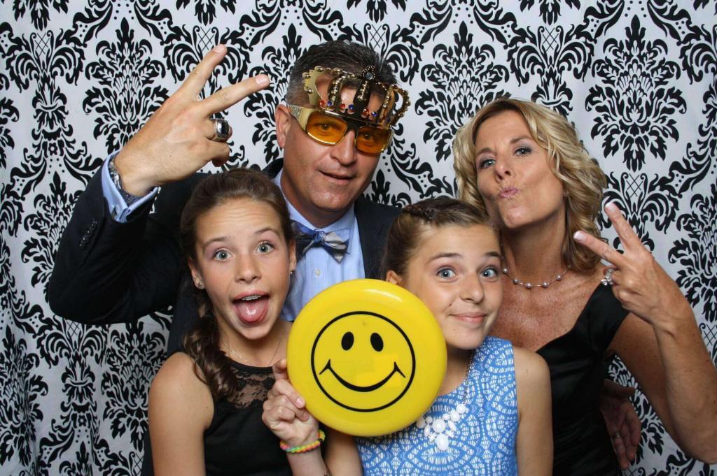 people with children in photo booth