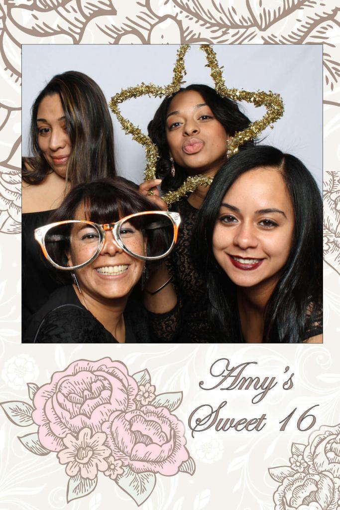 four women in photo booth