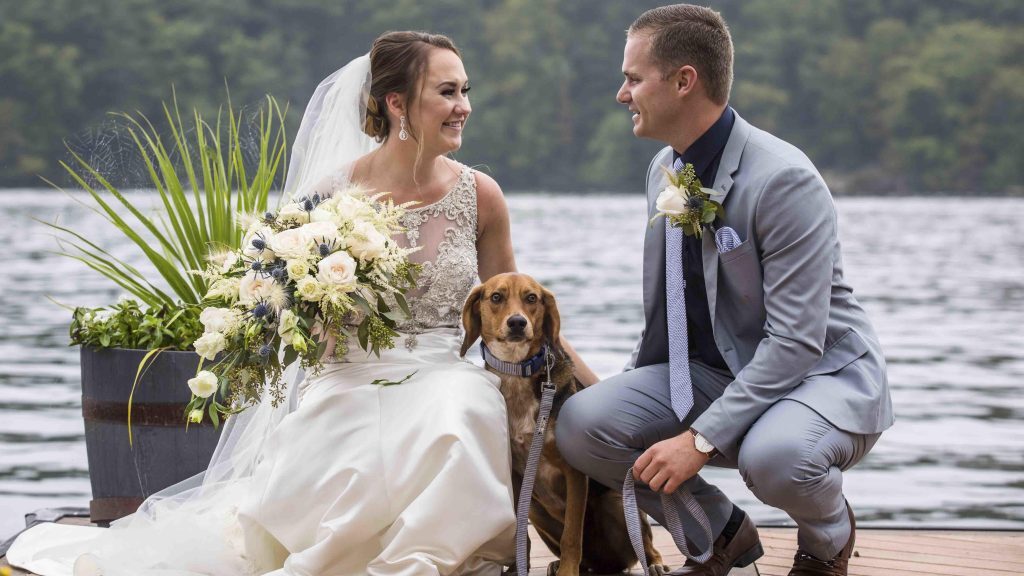 happy wedding couple with their dog