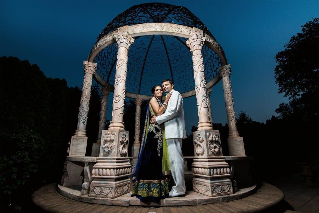 night photo of south asian wedding couple