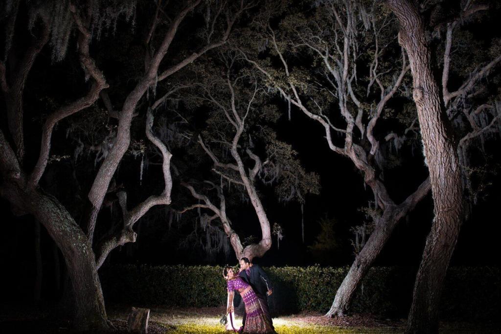 night photo of loving couple in the forest