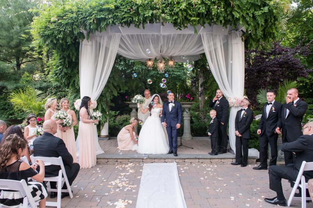 happy groom and bride at The Park, Belleville, New Jersey