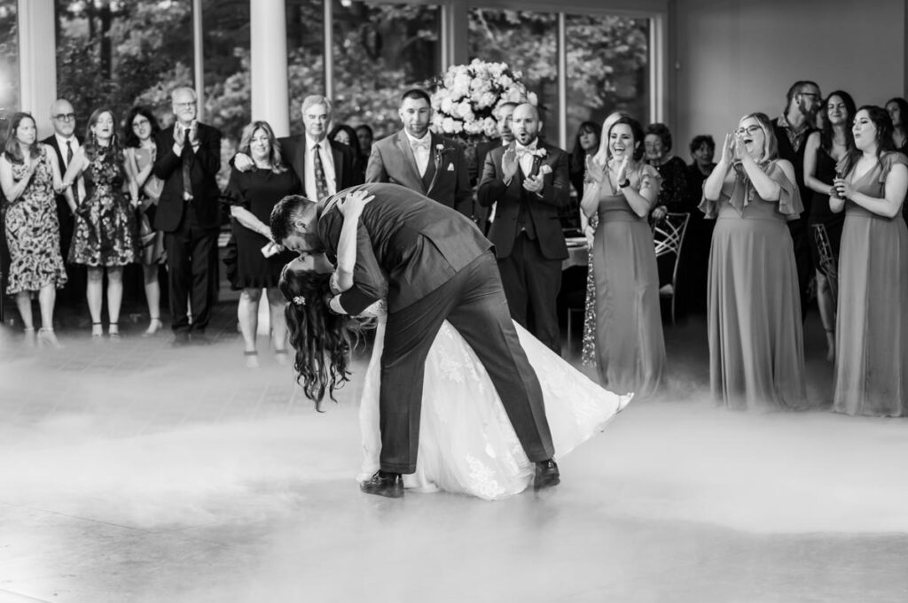Newlyweds kissing during dancing