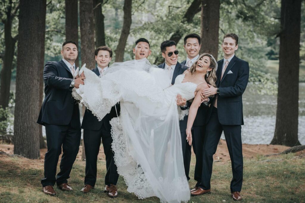 newlyweds with guests at Farrington Lake, East Brunswick
