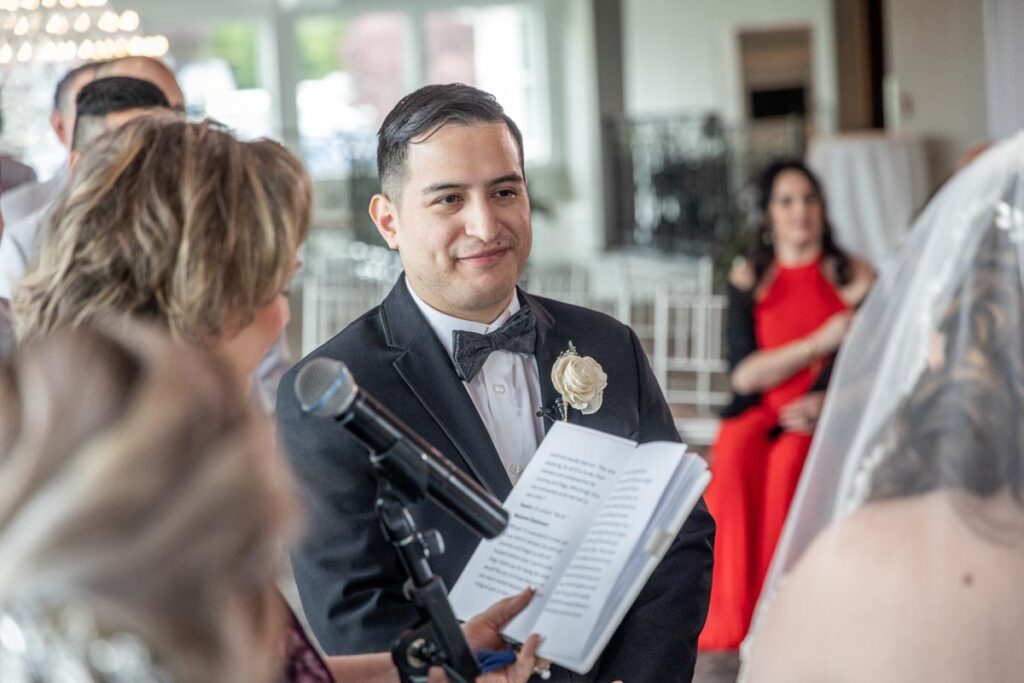 happy groom smiling to his bride - The Mill Lakeside Manor, Spring Lake, New Jersey