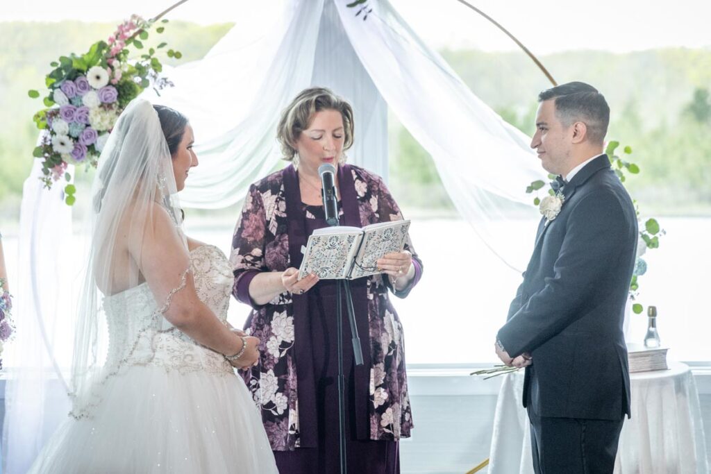 Bride and groom under arch, The Mill, NJ