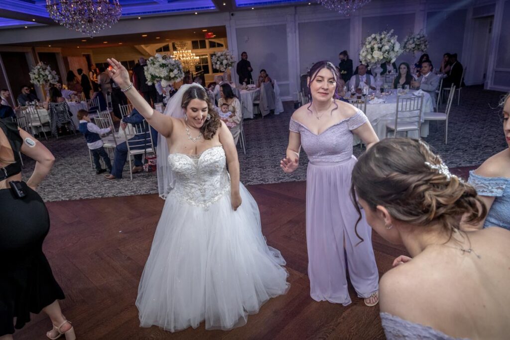 bride dancing with her friend at The Mill Lakeside Manor, Spring Lake, New Jersey
