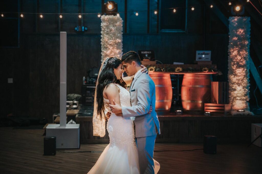 happy bride and groom dancing at Perona Farms