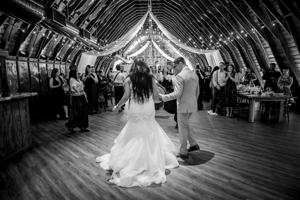 happy newlyweds dancing at Perona Farms