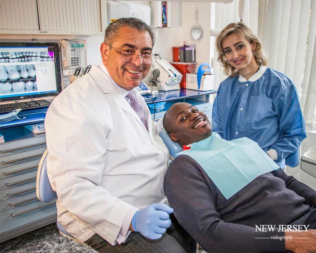 photo of dentist with their patient