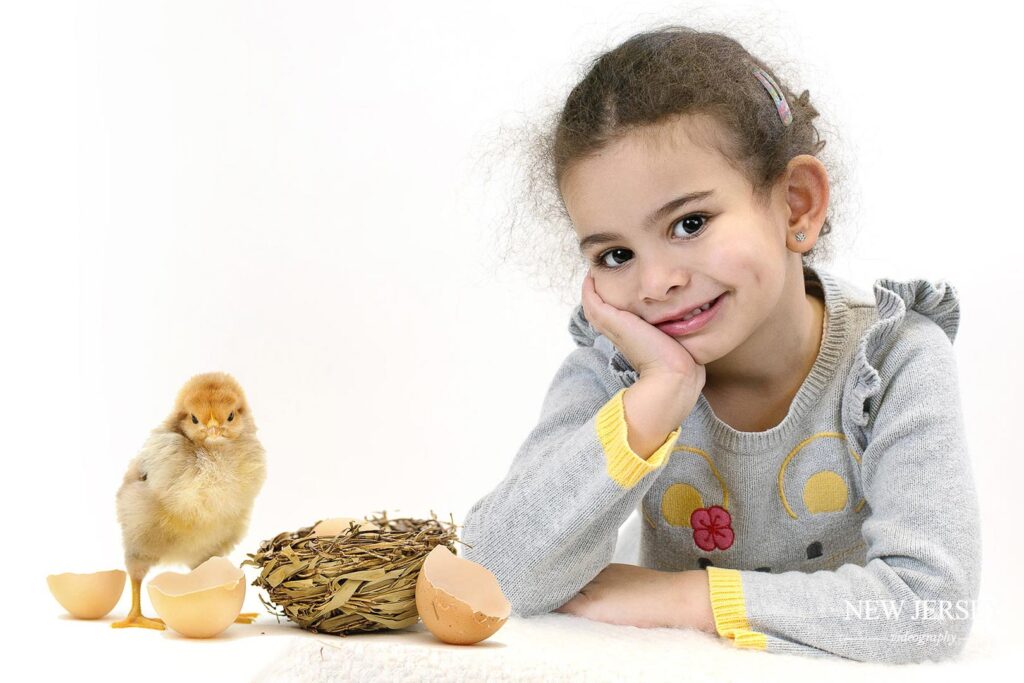 portrait of a kid with a chicken