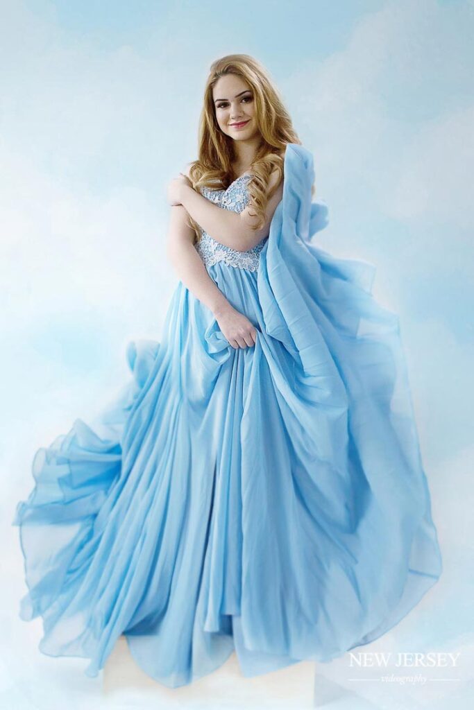 portrait of a woman in a blue dress