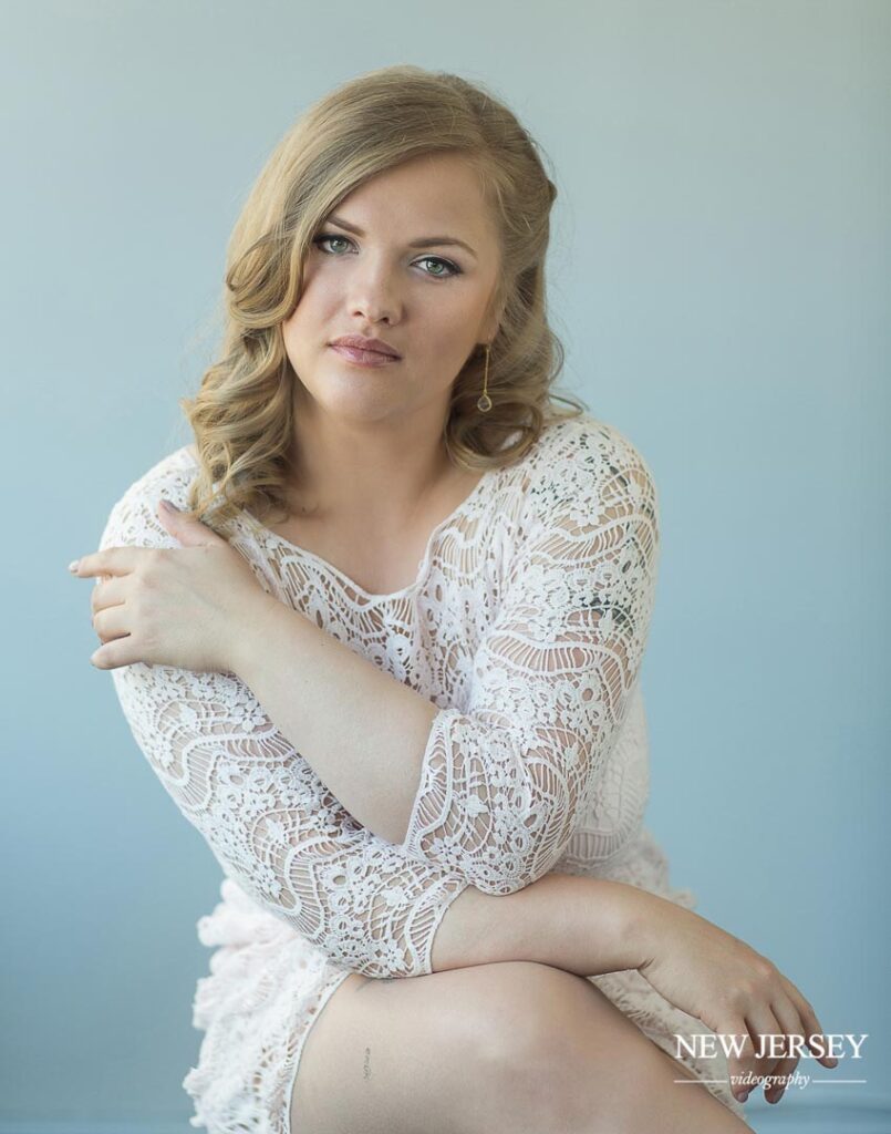 portrait of a young blonde woman in a white dress