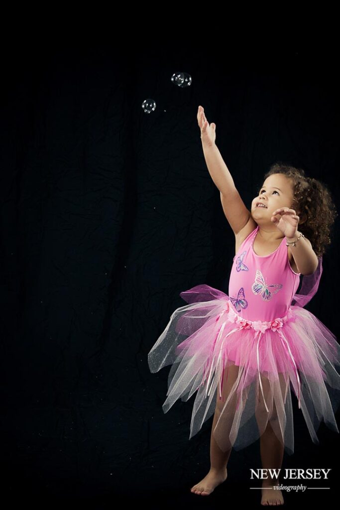 portrait of a little girl in a pink dress