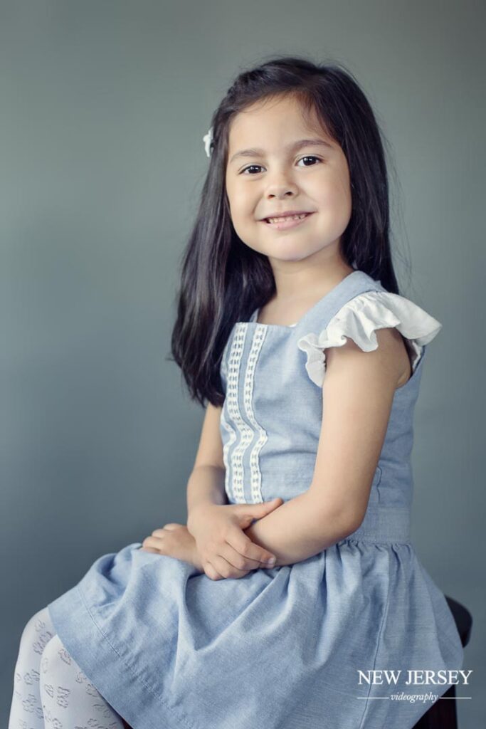 portrait of a little girl in a blue dress