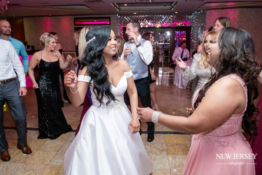 bride dancing with guests at Seasons Catering, Township of Washington, NJ