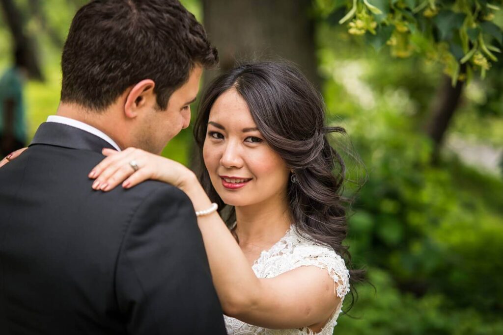 smiling bride with her groom