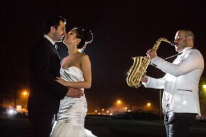 wedding couple dancing near musician