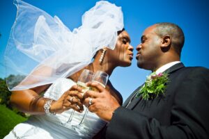 loving newlyweds holding glasses of champagne