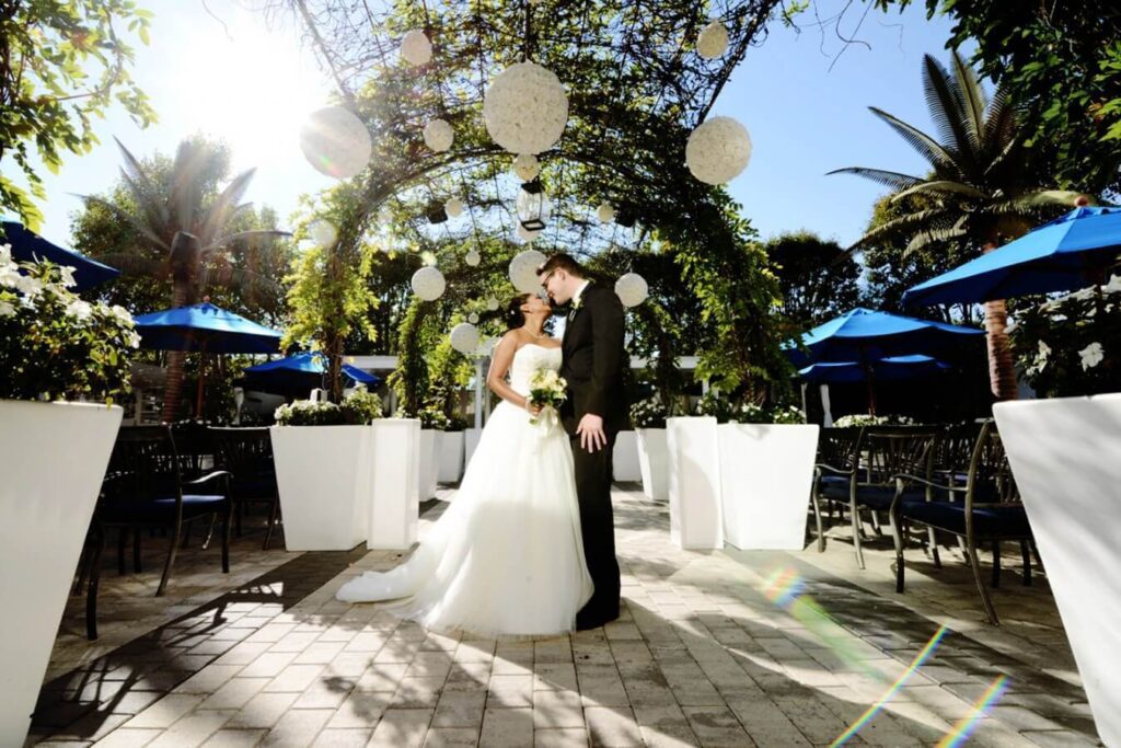 newlyweds standing under the arch