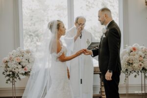 Bride and groom exchanging rings during their wedding ceremony