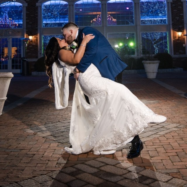 Photo of Newlyweds Dancing At The Wedding
